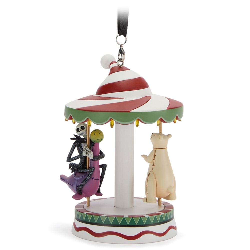 A whimsical carousel ornament featuring Jack Skellington and a bear, with a festive striped canopy and hanging loop.