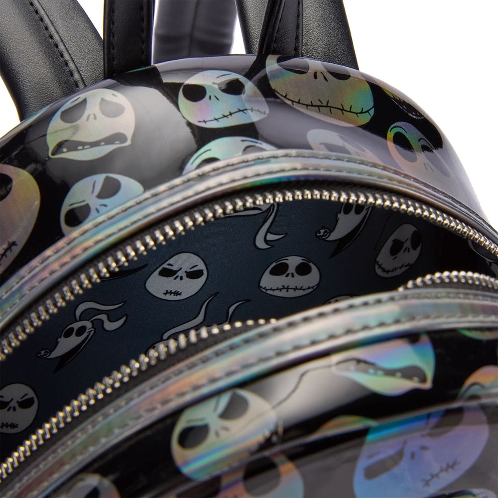 Close-up of a backpack with holographic Jack Skellington faces and expressions from "The Nightmare Before Christmas.