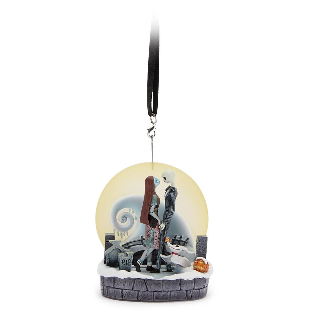Ornament of Jack and Sally from "The Nightmare Before Christmas" standing together with Zero in front of a yellow moon.