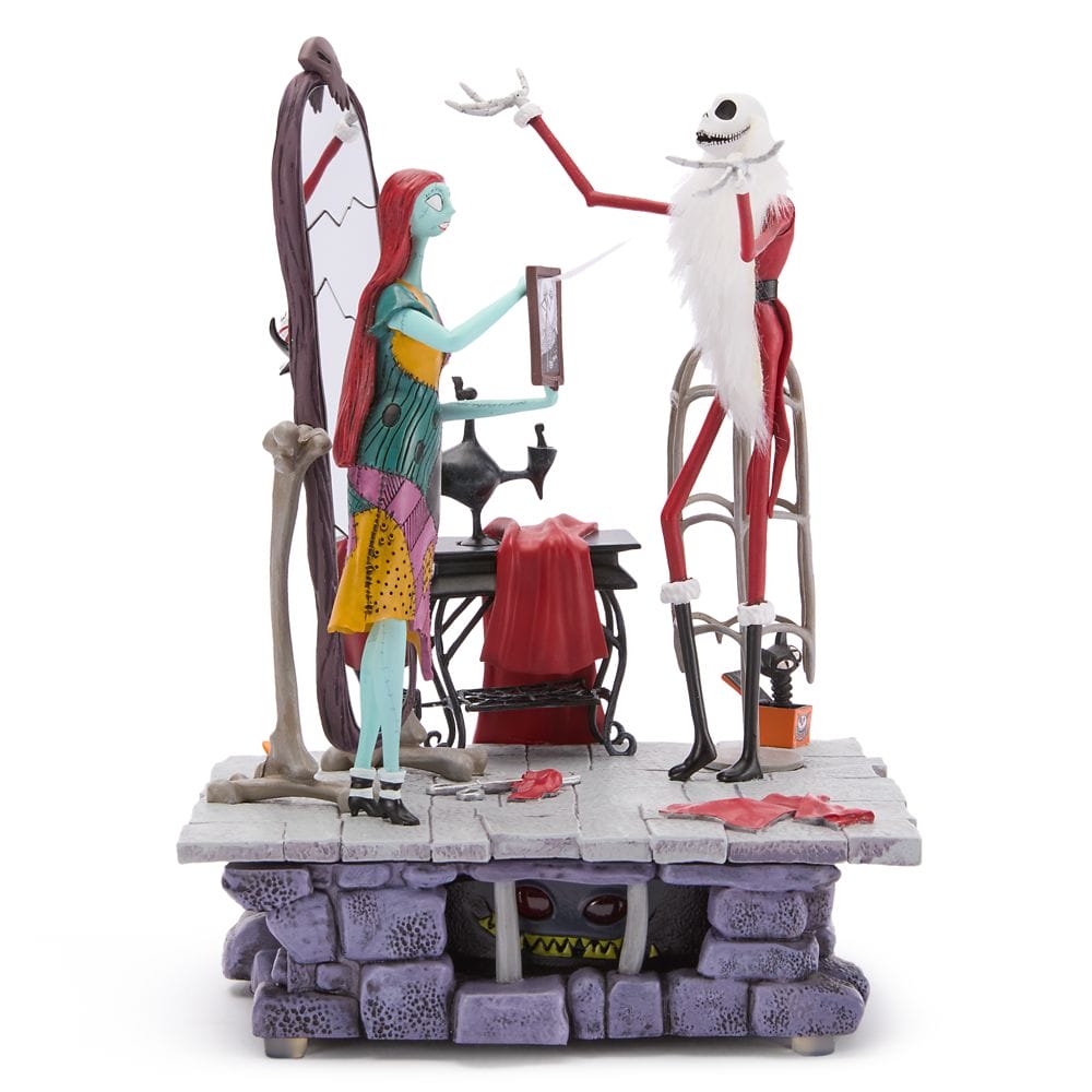 Figurines of Sally and Jack Skellington from "The Nightmare Before Christmas" in a sewing room setting.
