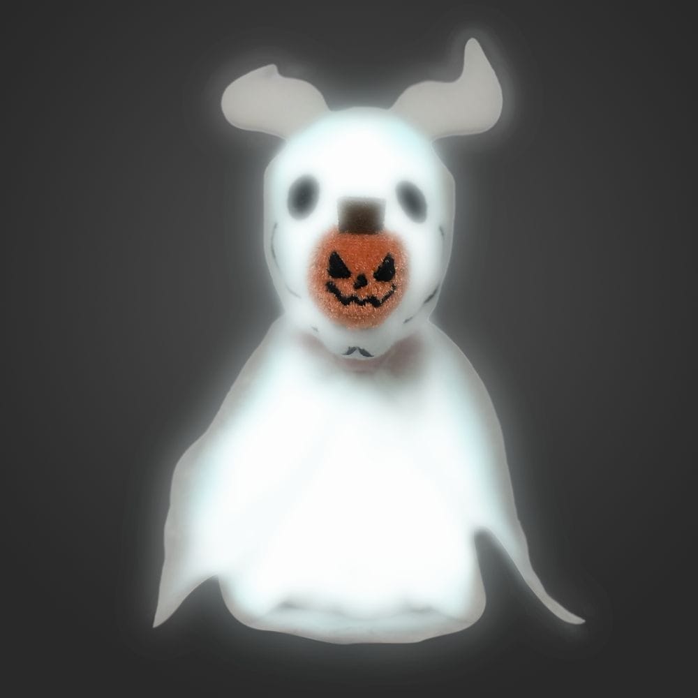 A ghost dog with floppy ears and a pumpkin-shaped nose glows against a dark background.