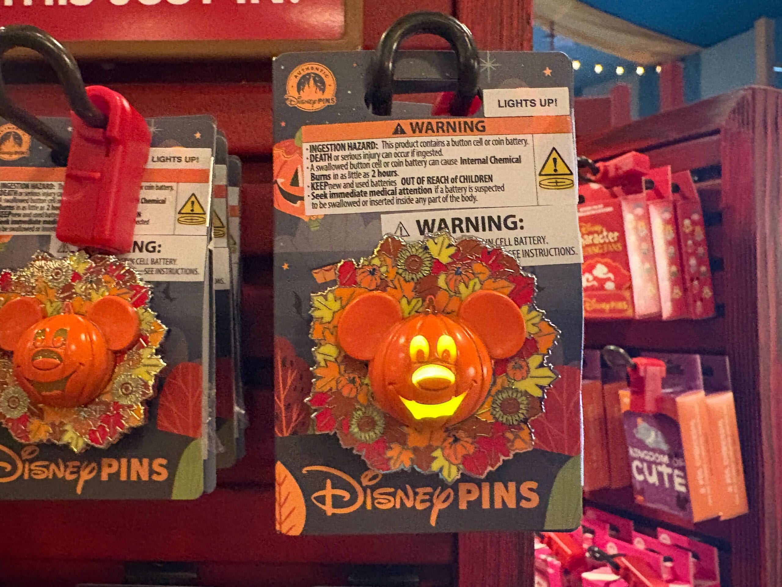 Disney pin featuring a glowing Mickey Mouse pumpkin, part of the 2025 Halloween merchandise at Walt Disney World.