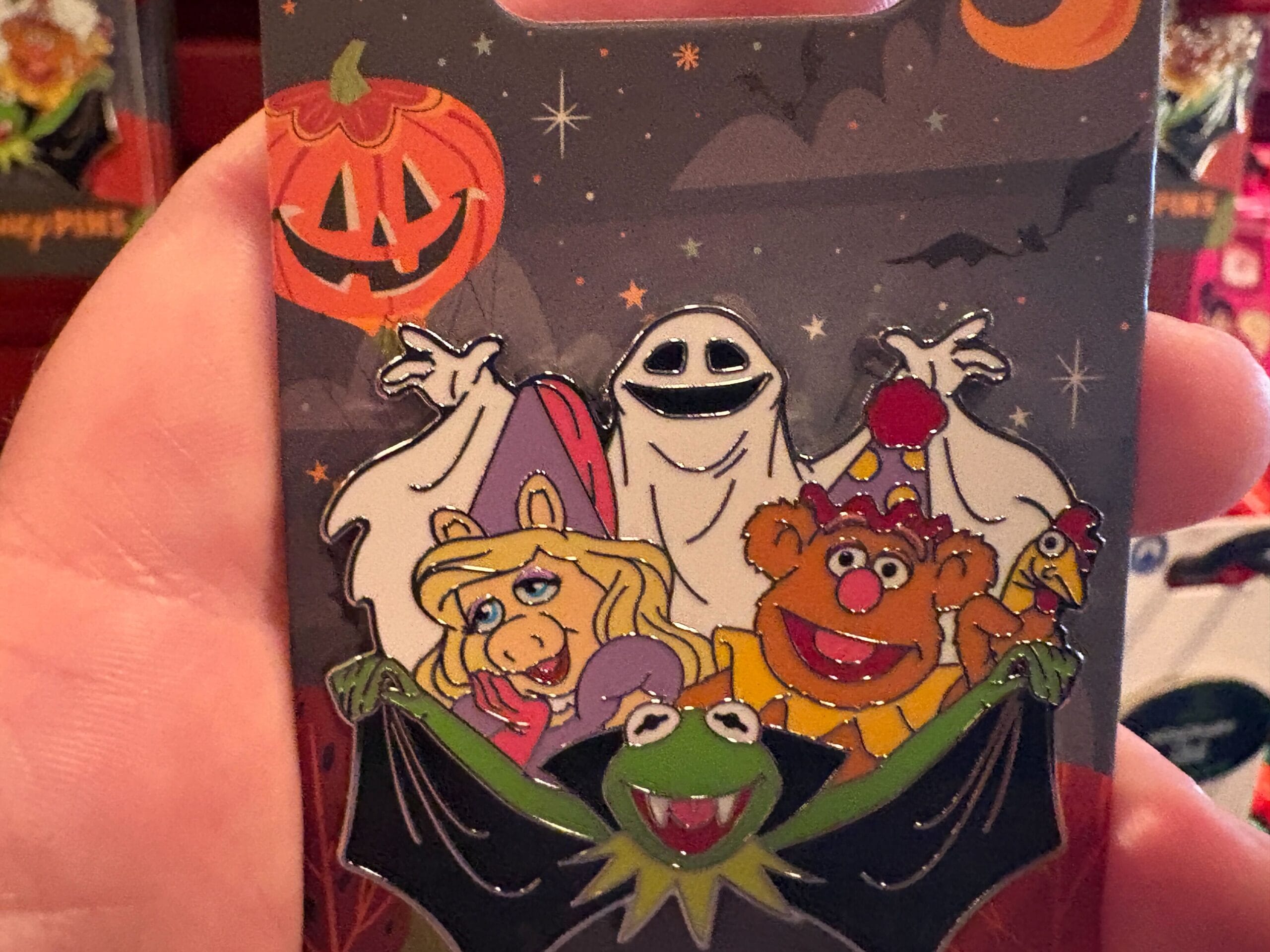A 2025 Halloween merchandise pin from Walt Disney World featuring Kermit as a bat, Miss Piggy, Fozzie, and a ghost.