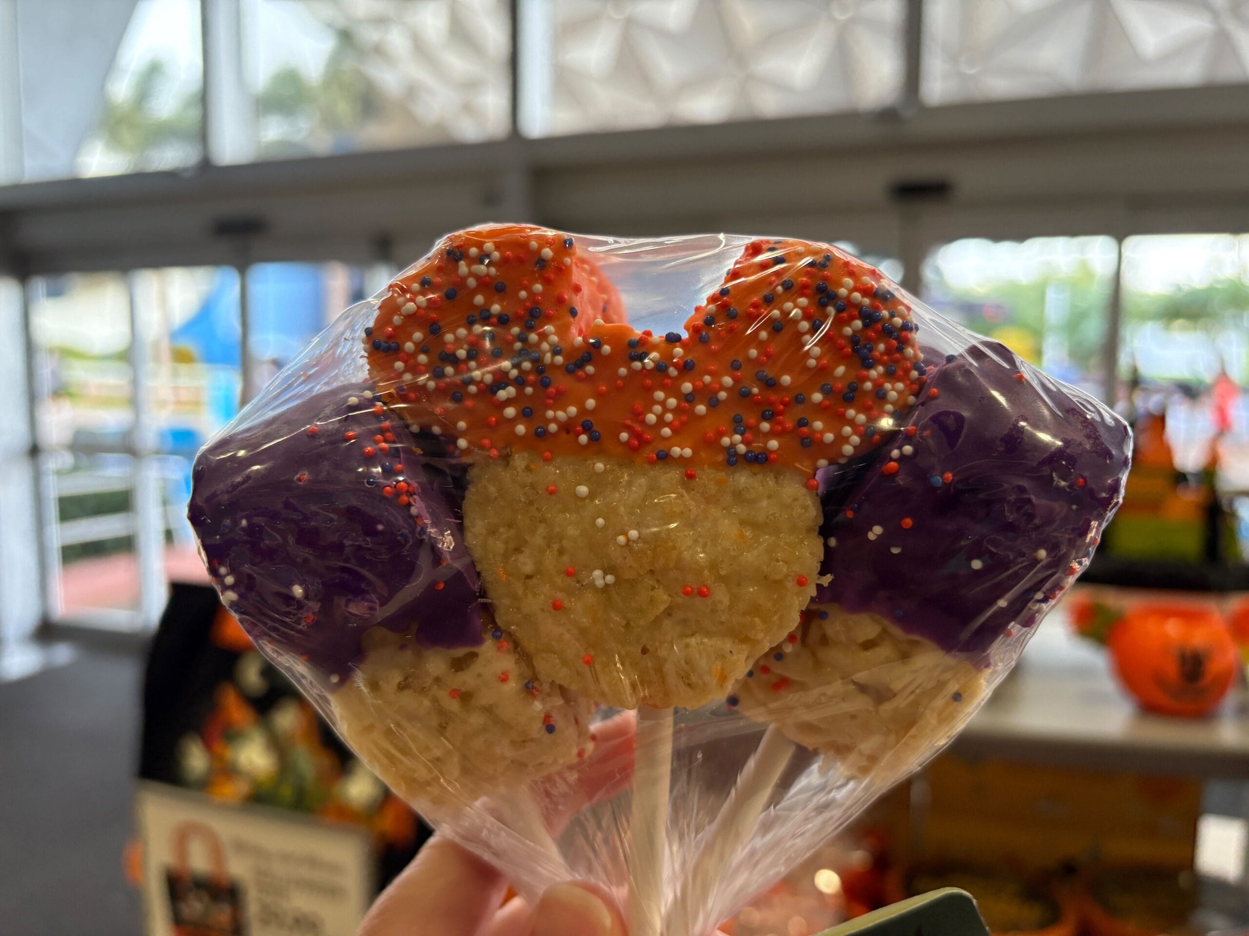 A Mickey Mouse-shaped Rice Krispies treat with festive icing, part of 2025 Disney Halloween Merch at Walt Disney World.