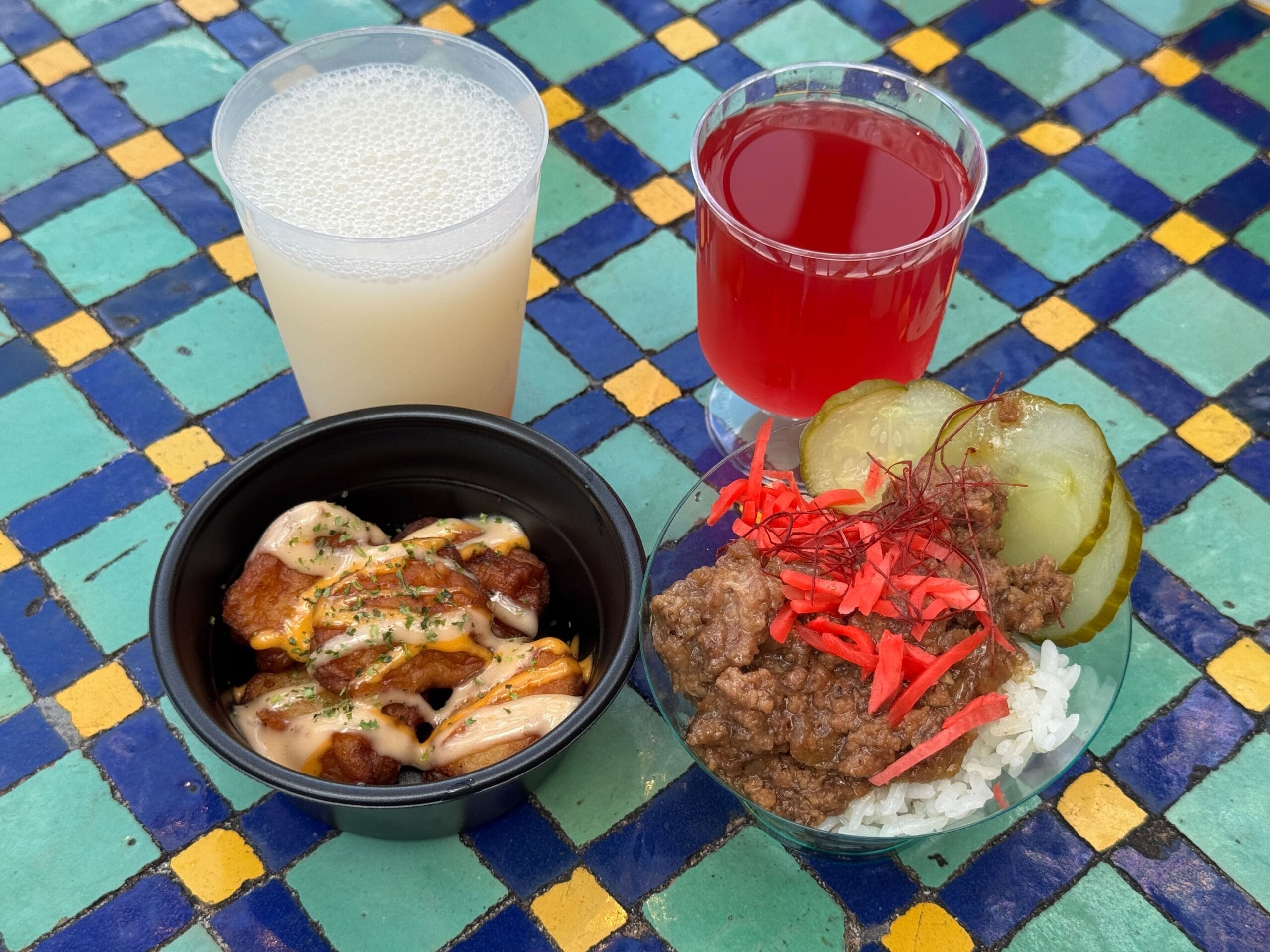 Enjoy Japanese dishes with pickled ginger, rice, and fried chicken at the EPCOT Food and Wine Festival.