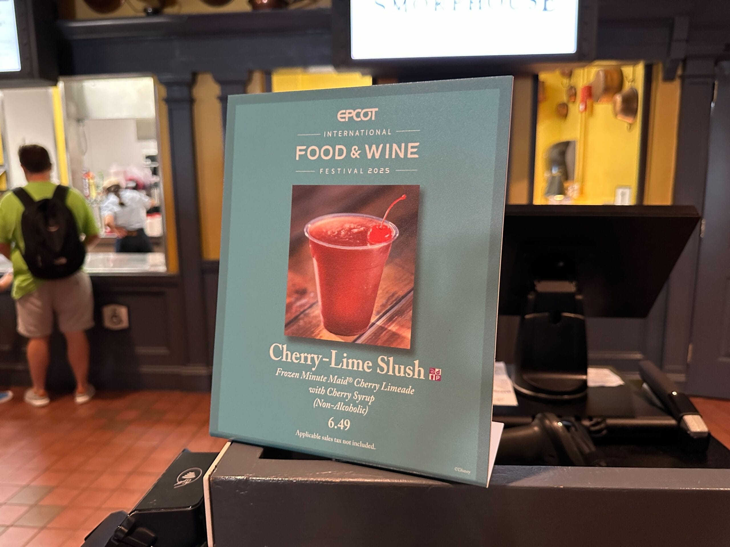 Menu sign for a New Food & Wine Cherry-Lime Slush at EPCOT Food & Wine Festival 2023, priced at $6.49.