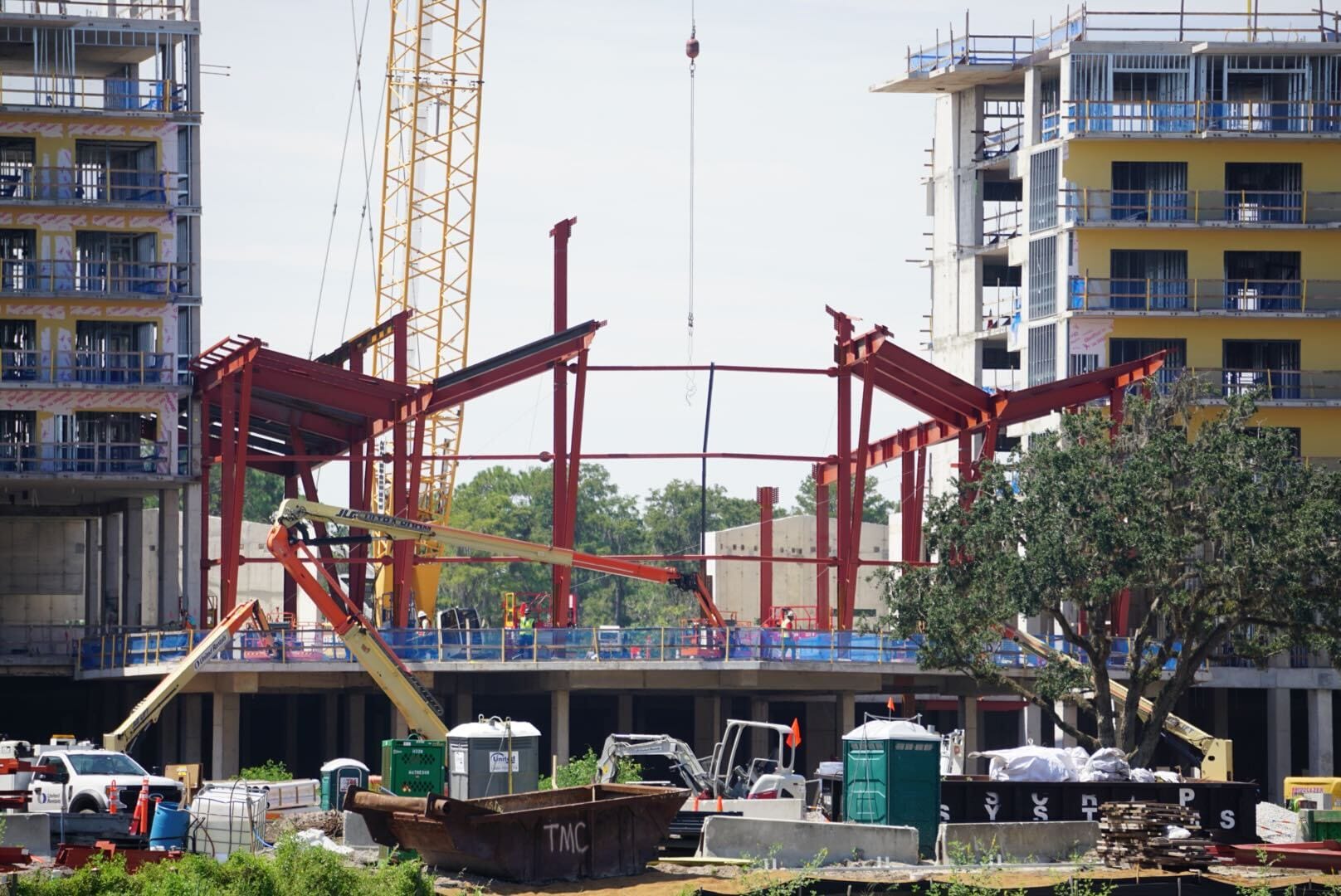 Steel beams are being installed on the Lakeshore Update construction site between two multi-story buildings.