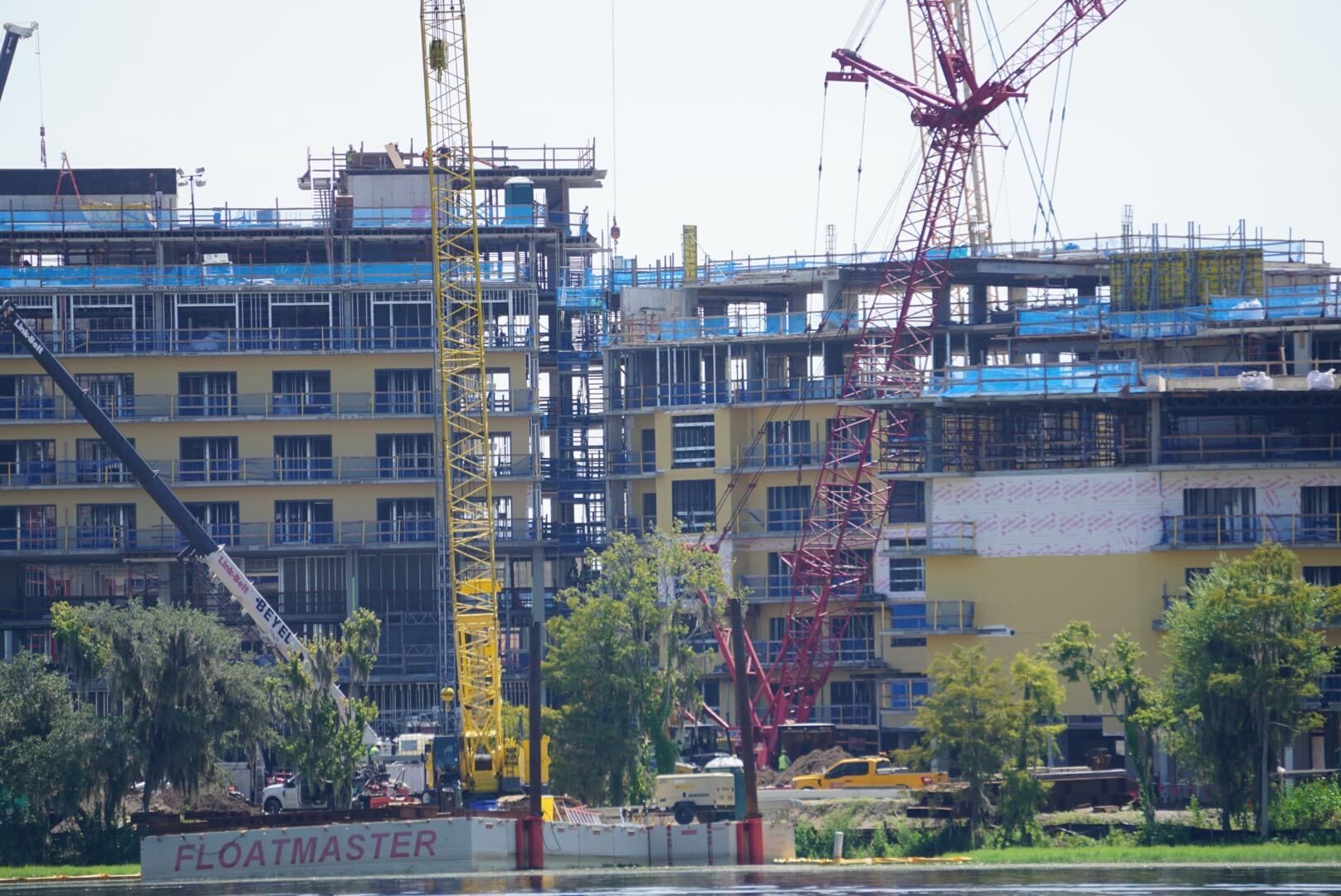 Yellow and red cranes operate at a riverside construction site in this latest Lakeshore Update.