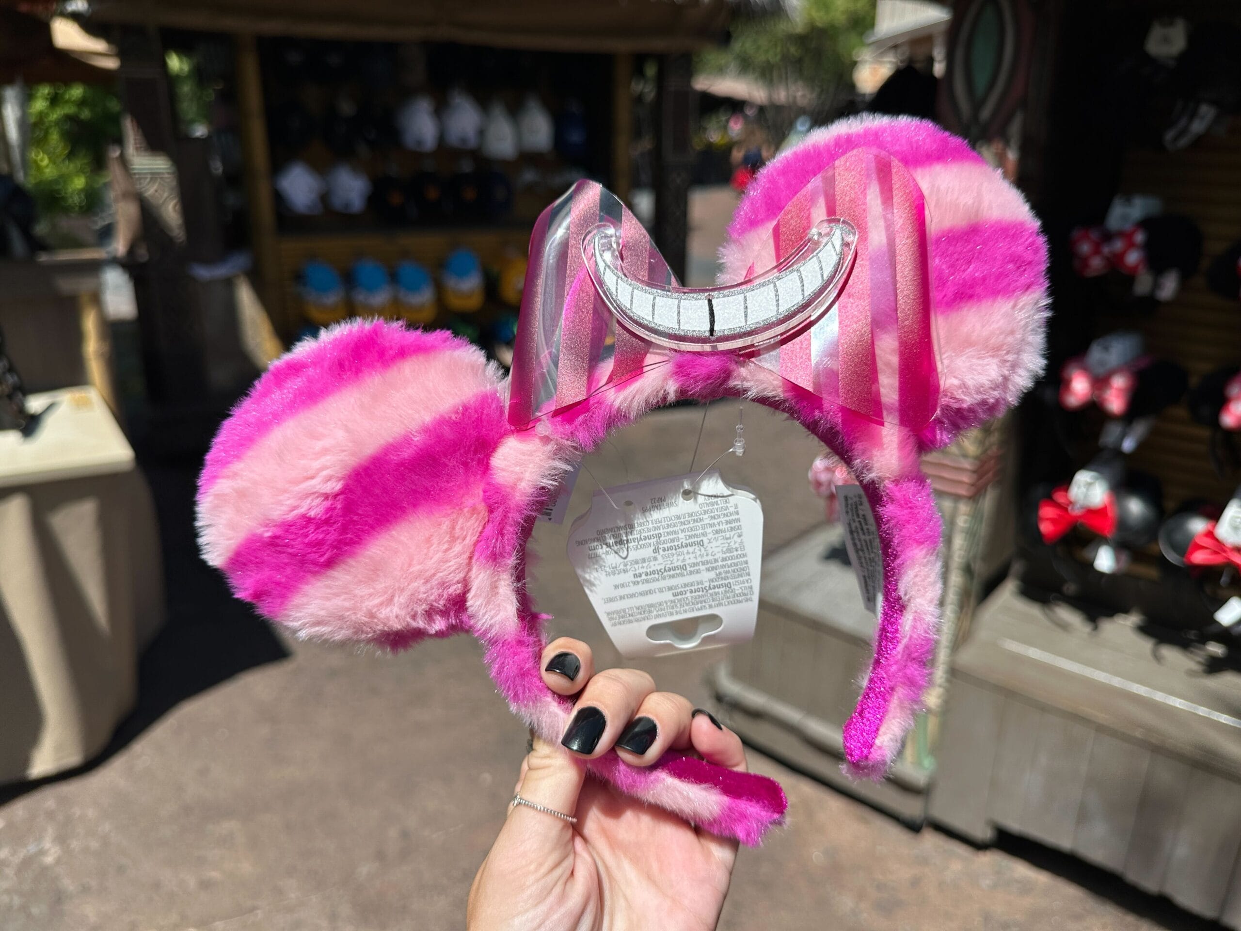 Cheshire Cat Ear Headband with a grinning smile at Bwana Bob's outdoor shop