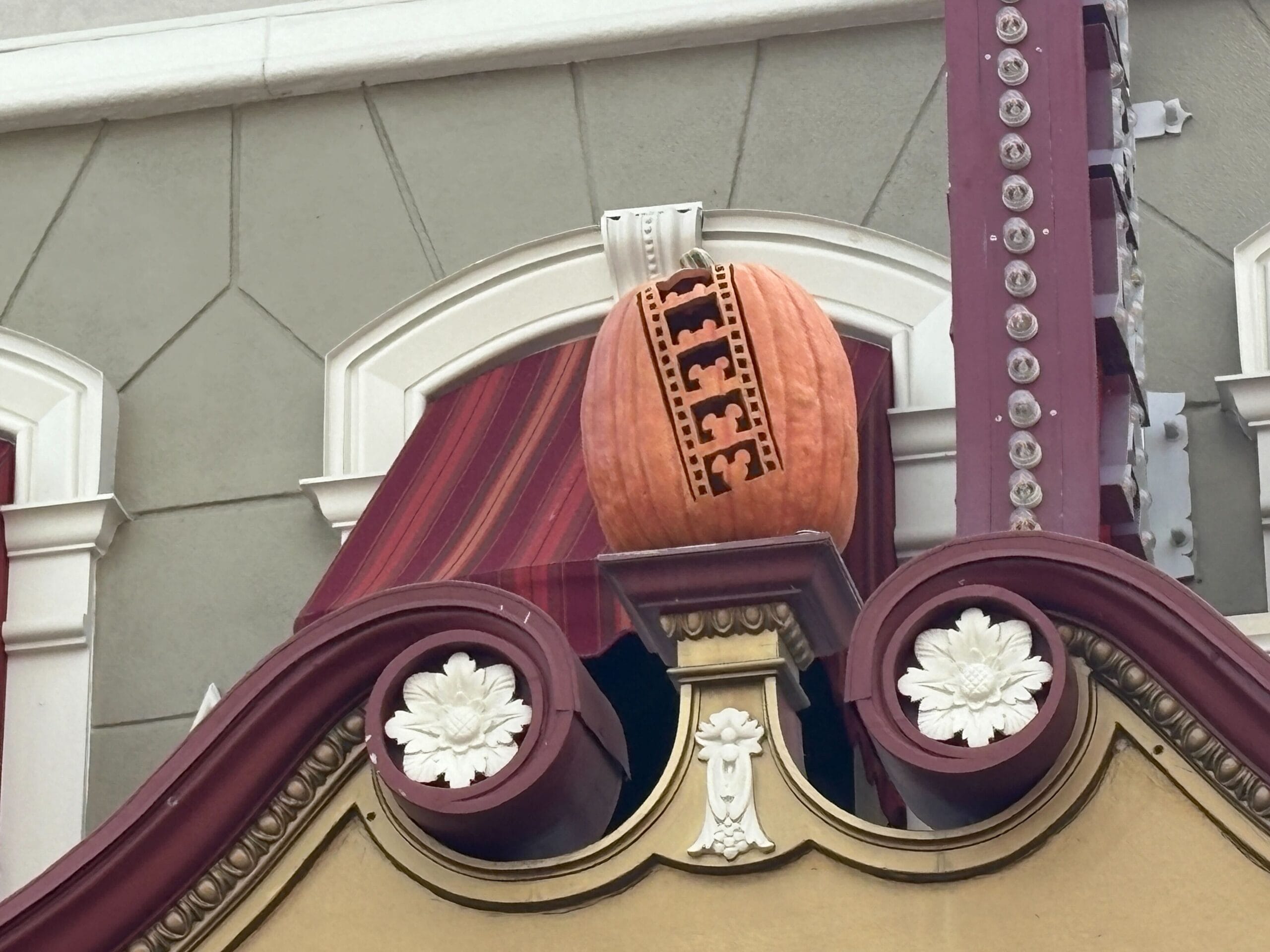 A large pumpkin carved with "ICE" tops Halloween decor at Magic Kingdom for Mickey’s Not So Scary Halloween Party 2025.