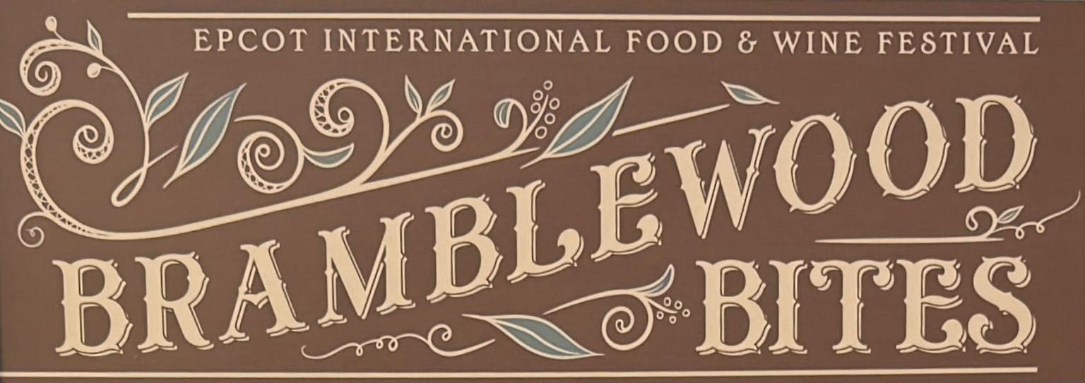 Sign reading "Bramblewood Bites" at EPCOT International Food & Wine Festival, adorned with decorative vine designs.