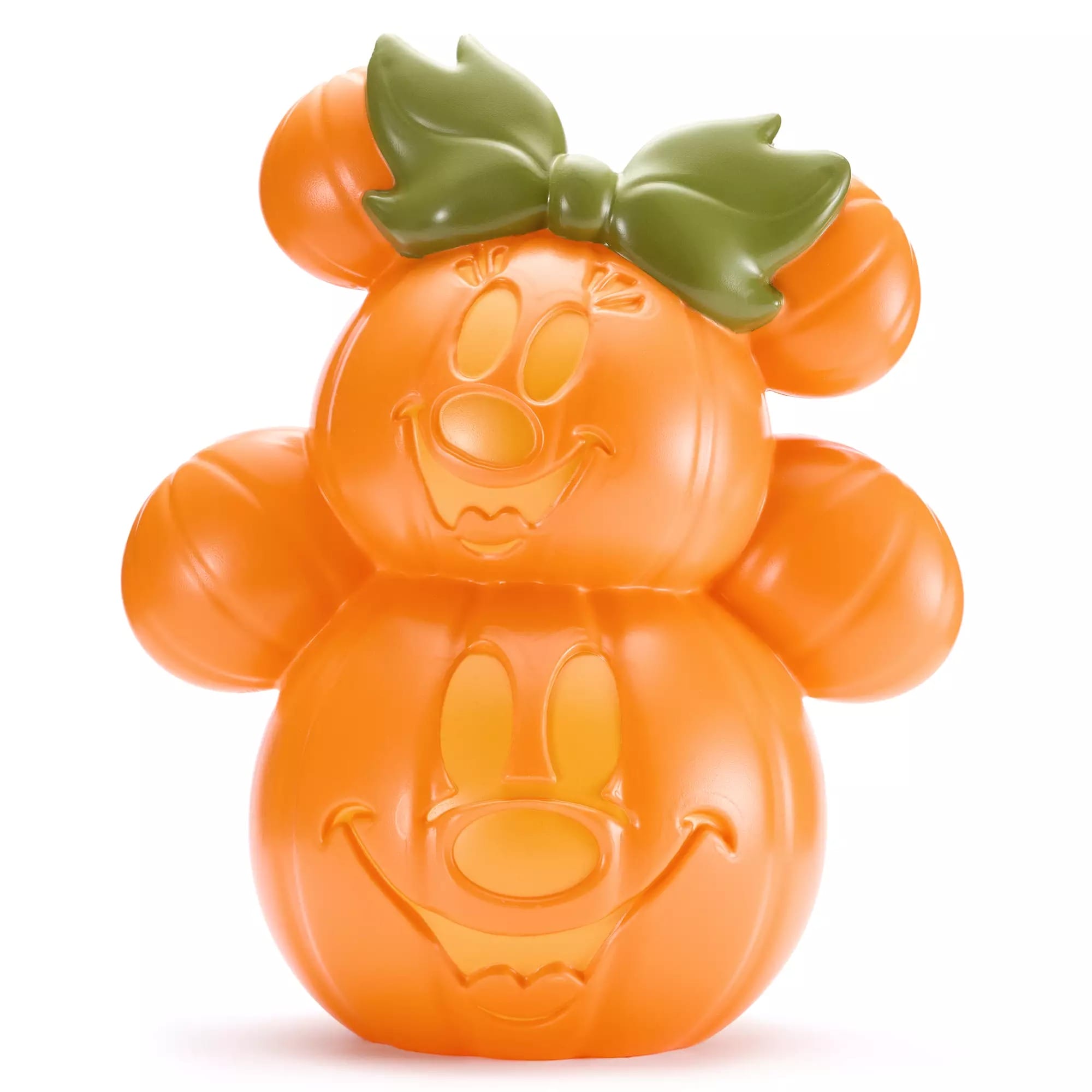 Orange pumpkin decoration shaped like Minnie Mouse with carved face and a green bow on top.