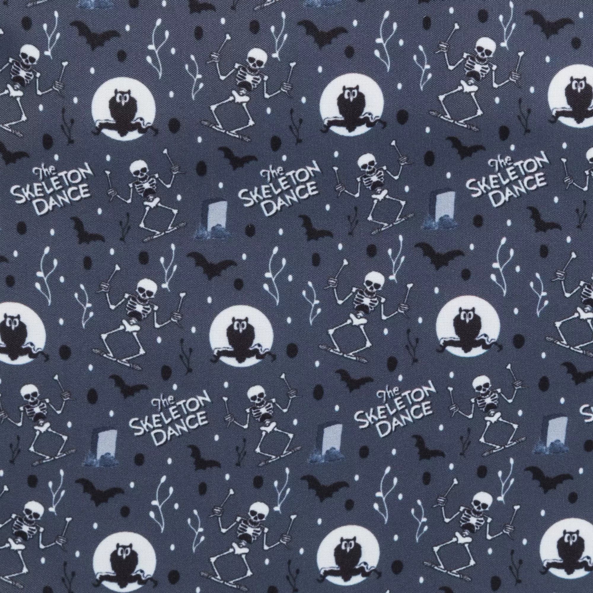 Pattern with dancing skeletons, black cats, bats, and "The Skeleton Dance" text on a Glow-in-the-dark Loungefly backpack.