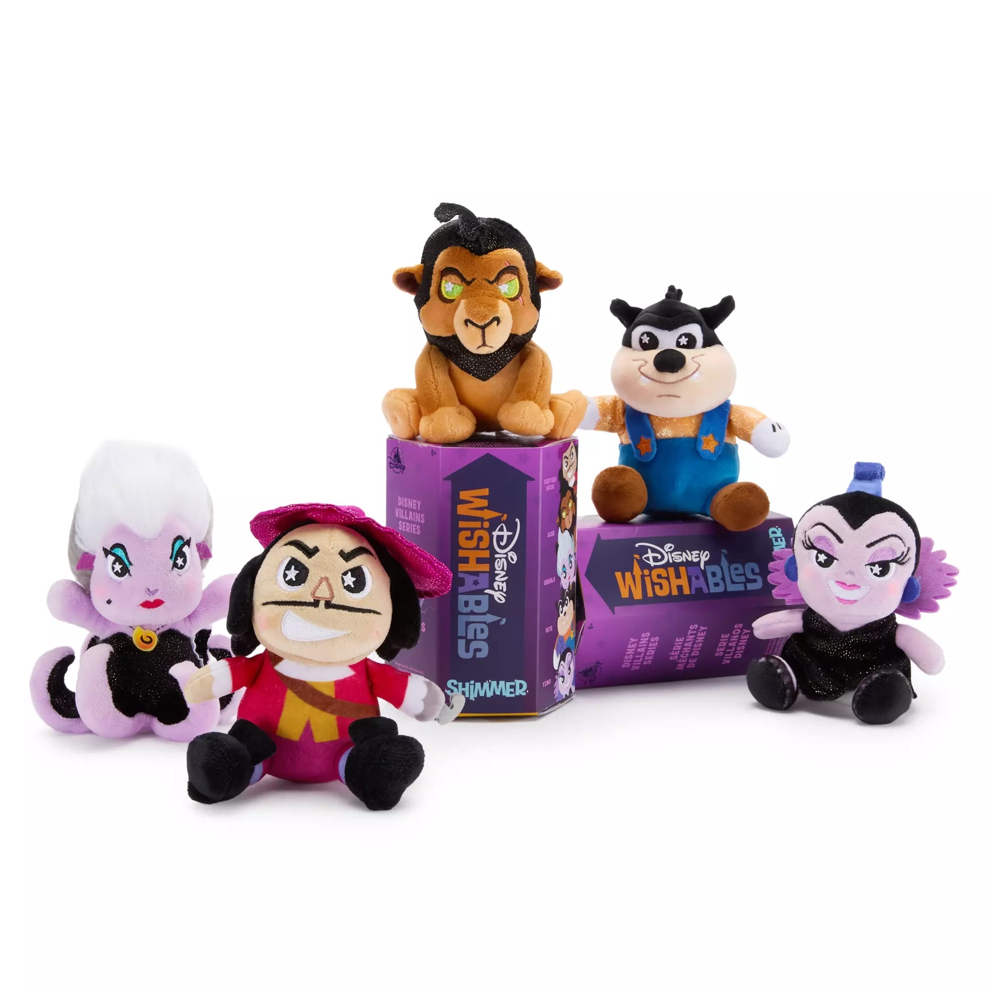 Five Disney Villains plush toys are arranged around two Wishables boxes on a white background.