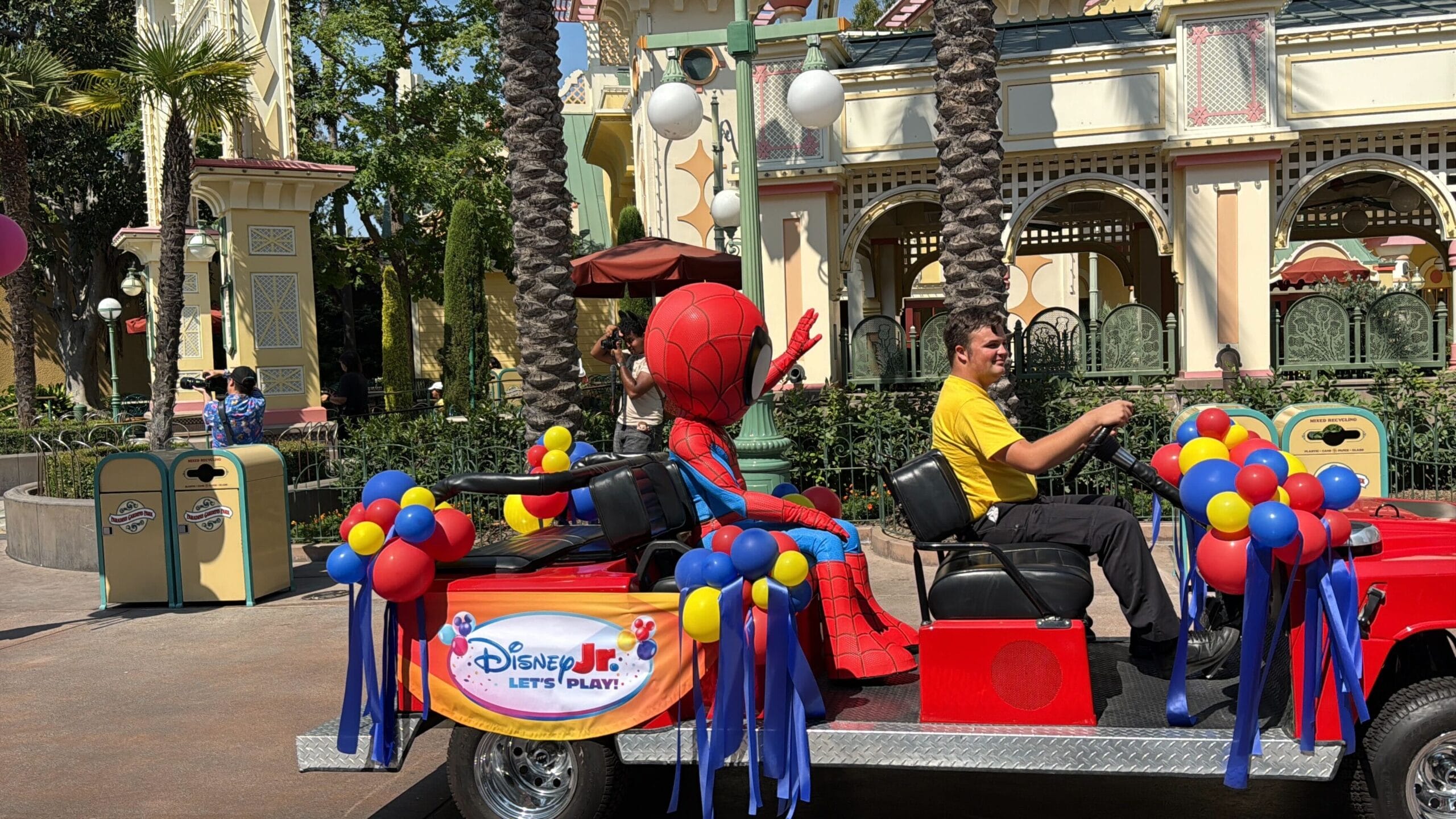 Spiderman waves from a decorated vehicle during the Block Party Cavalcade at Disneyland Resort.
