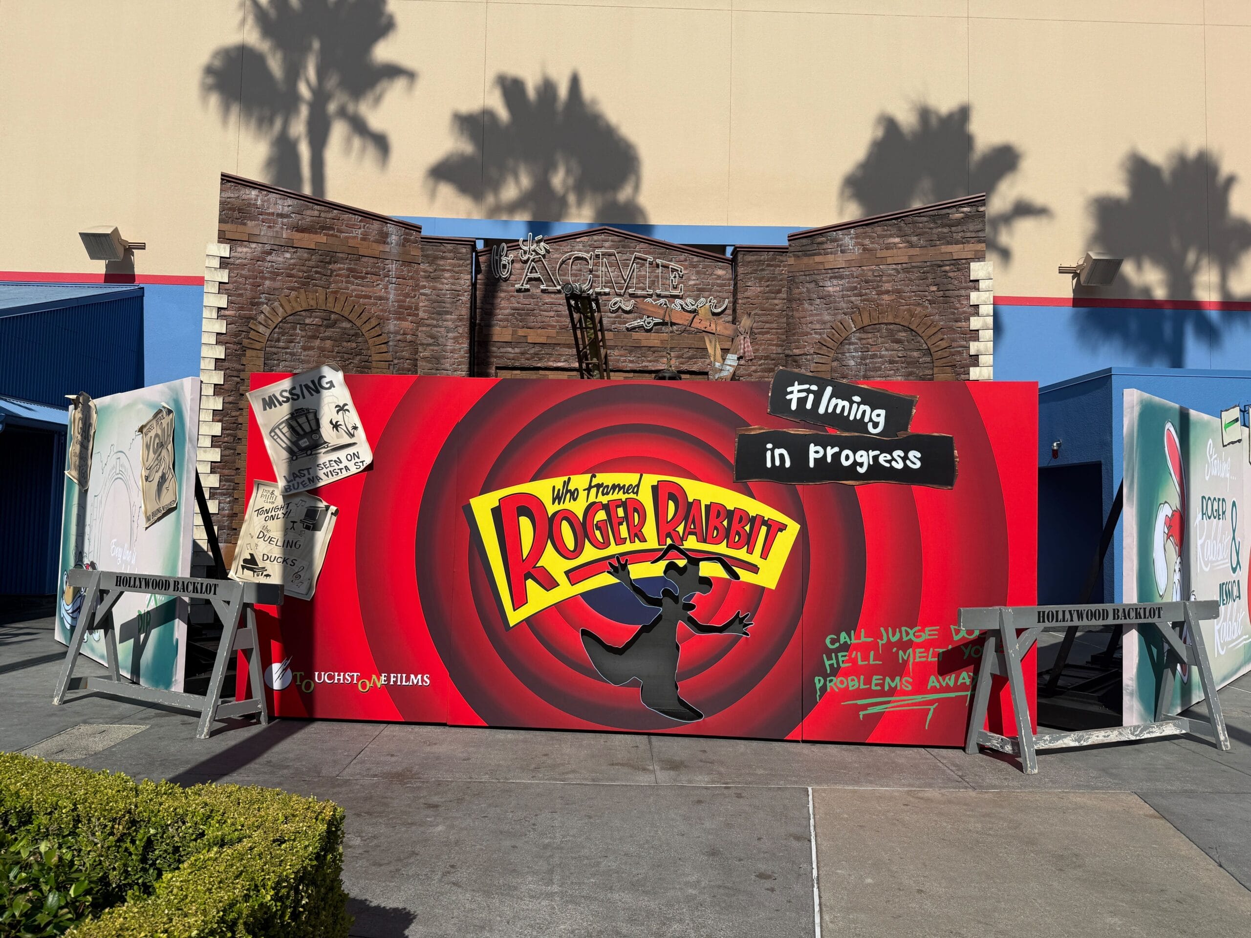 Roger Rabbit-themed movie set display with "Filming in progress" sign and cartoon-style props outdoors.