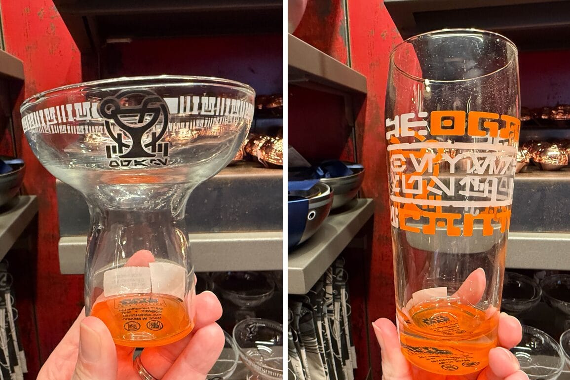 Two unique Star Wars-themed glasses with alien script, inspired by Oga's Cantina at Disneyland Park, on store shelves.