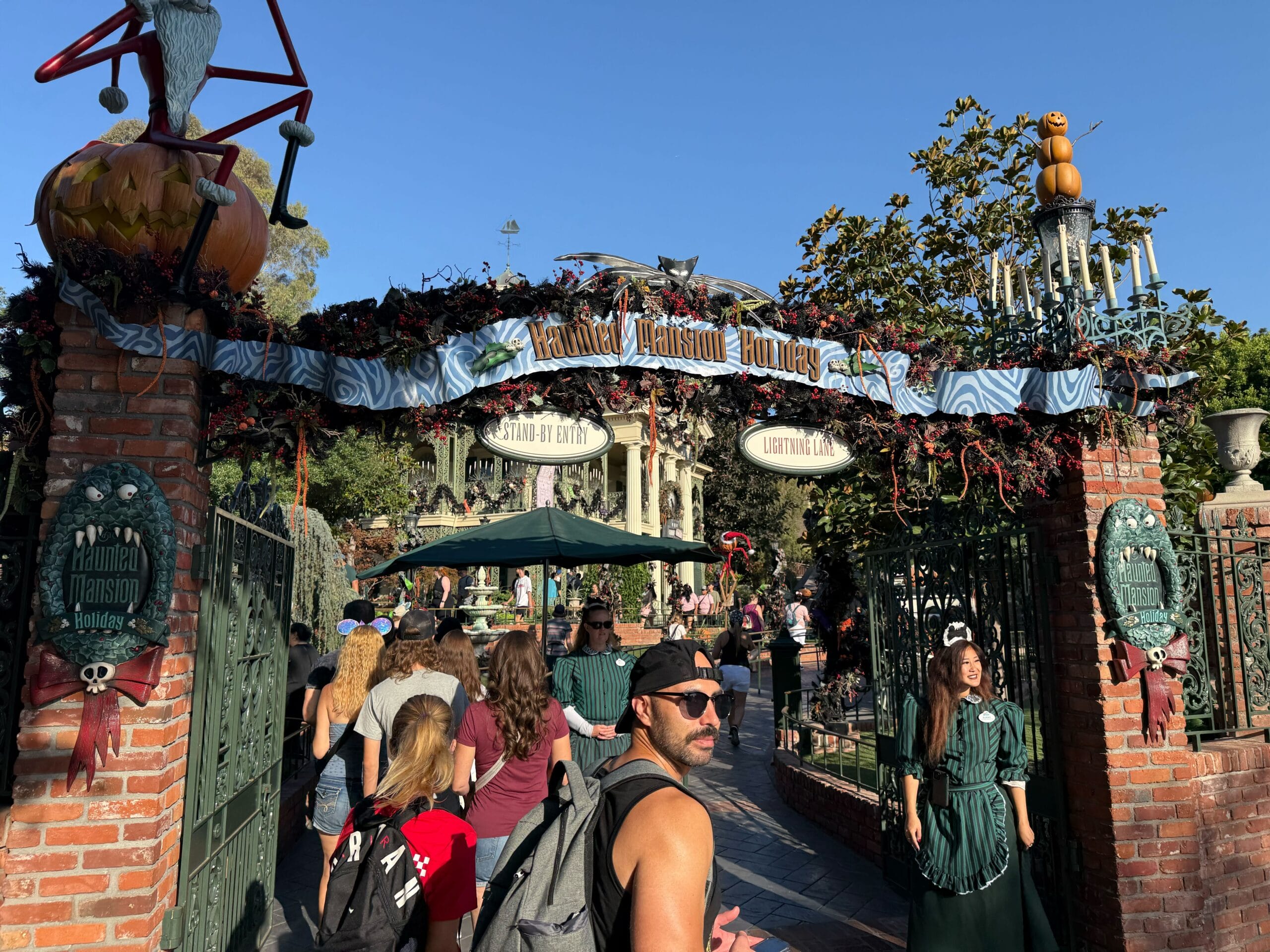 Guests enter the Haunted Mansion Holiday, inspired by Nightmare Before Christmas, decked in Halloween and Christmas magic.