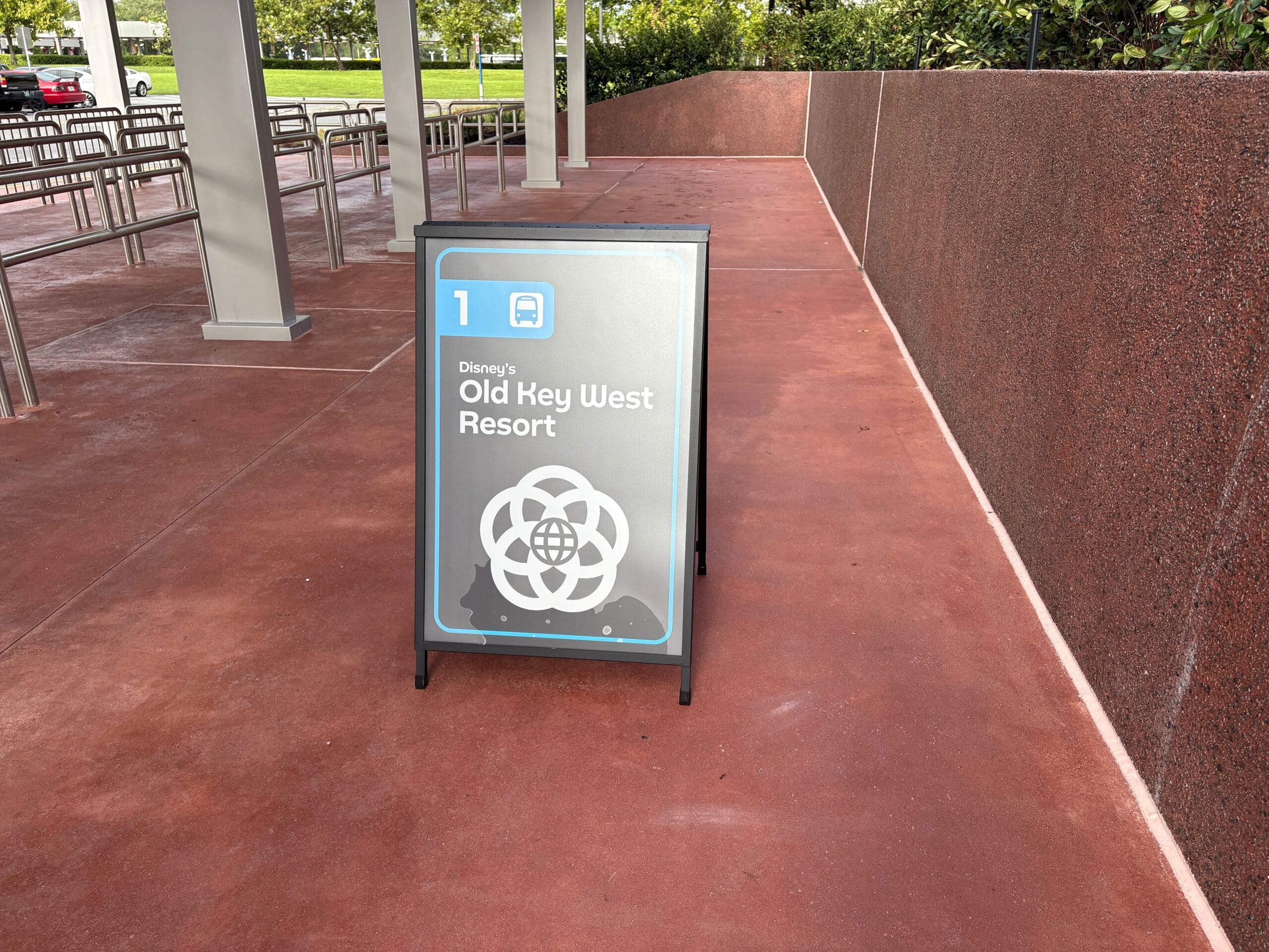 A sign reads "Disney's Old Key West Resort" with a bus symbol and EPCOT listed at a Bus Stop Expansion area.