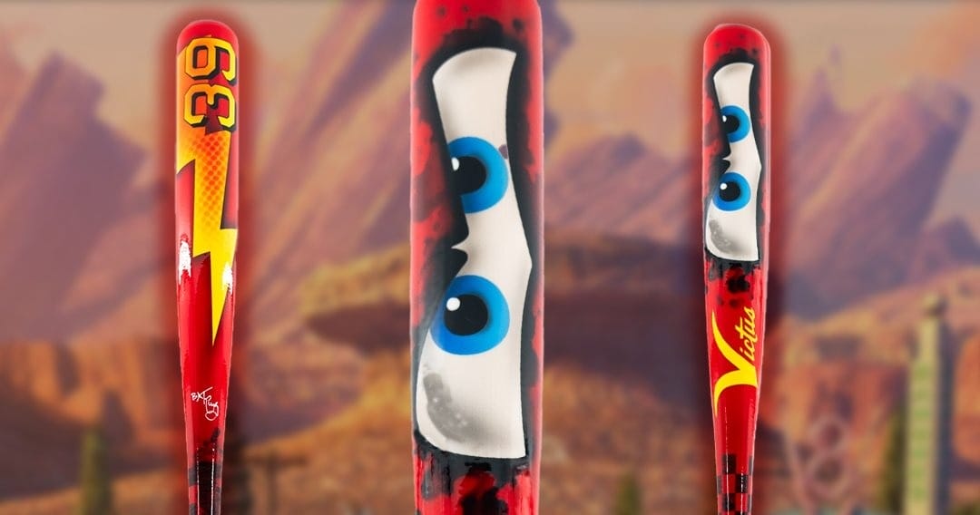 Red baseball bat with cartoonish blue eyes, yellow lightning bolt, and the number 95, set against a desert background.