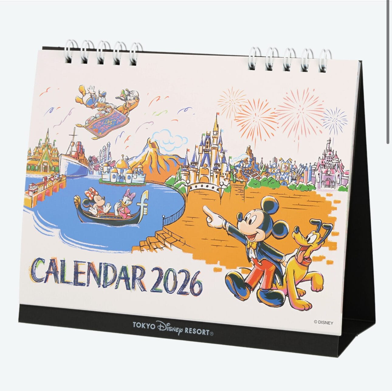 Spiral-bound 2026 Tokyo Disney Resort calendar with Mickey, Pluto, park icons, and vibrant fireworks—perfect for planners.