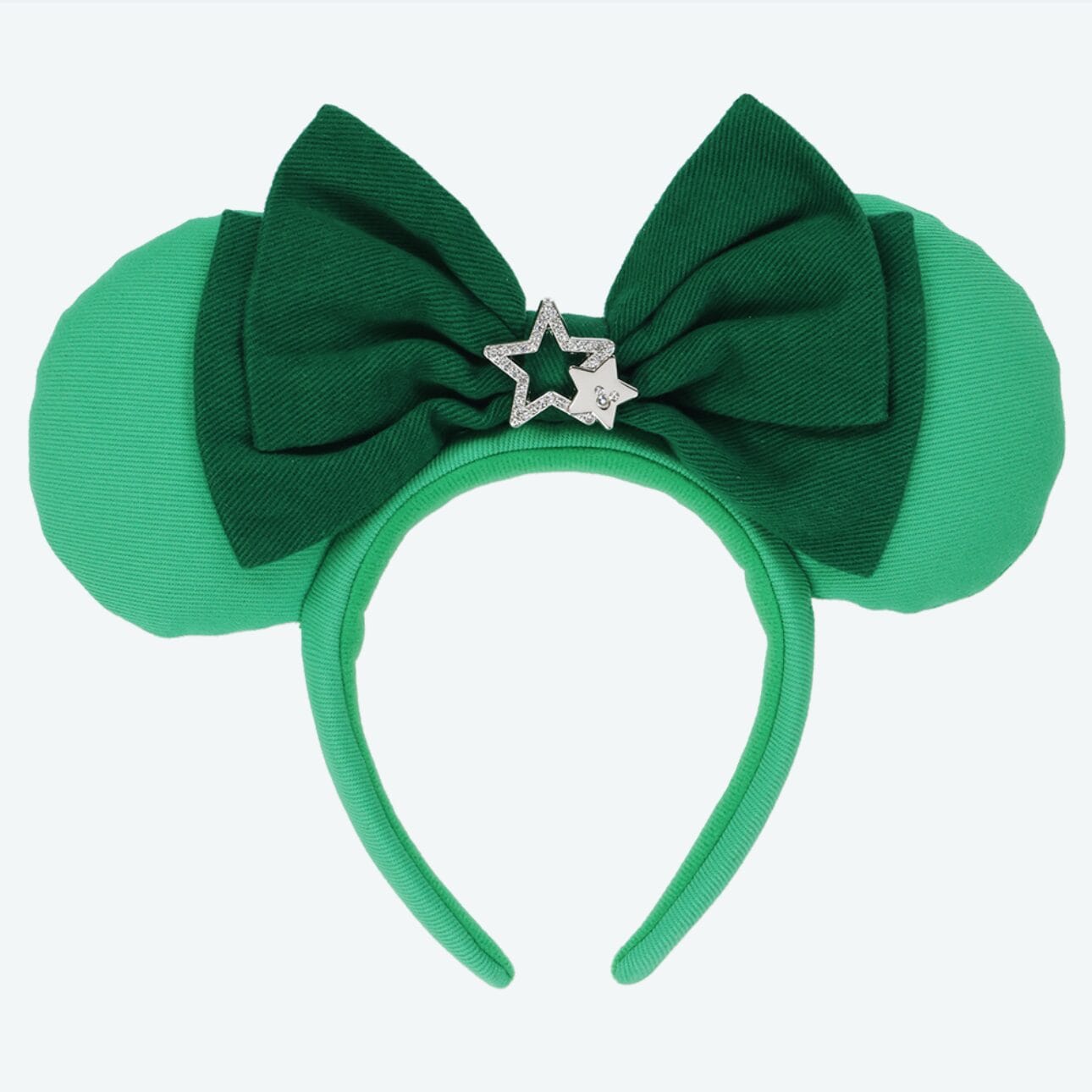Green mouse ear headband with a dark green bow and silver star charm, inspired by Tokyo Disney Resort.