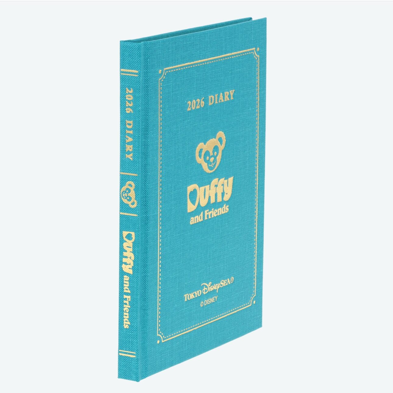 A teal 2025 diary with gold text and a bear face from Tokyo Disney Resort, titled "Duffy and Friends.