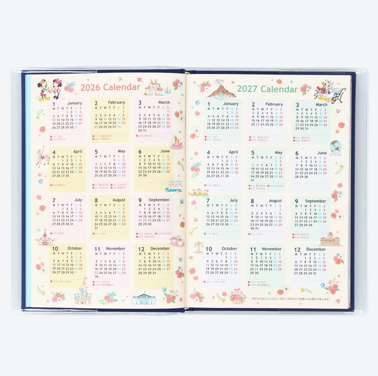 Open planner featuring 2026 calendars and Tokyo Disney Resort illustrations with colorful decorations on each page.