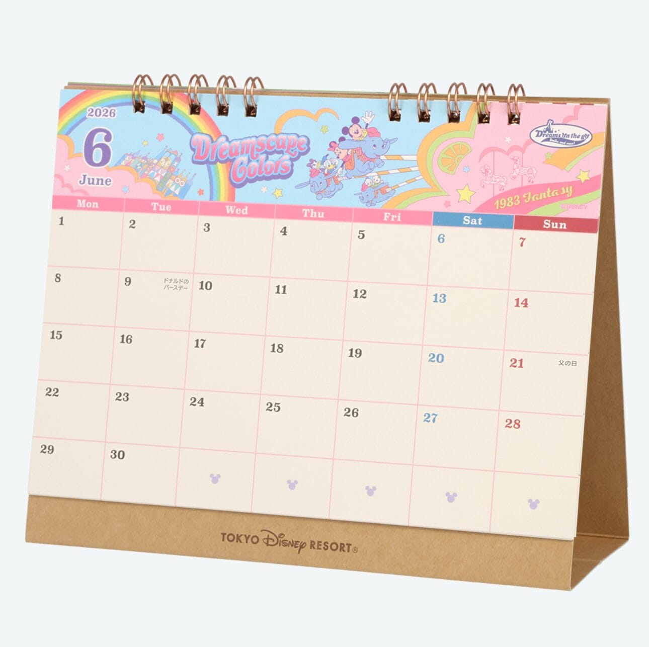 June 2026 desk calendar with colorful Tokyo Disney Resort design and cartoon characters wearing Ear Headbands at the top.