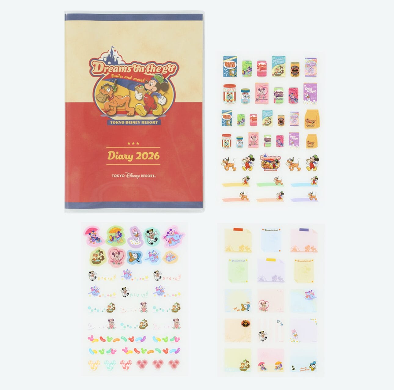 Tokyo Disney Resort 2026 diary with colorful character stickers, decorative sticky notes, and planners beside it.