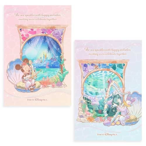 Two pastel Disney postcards with Ariel and Mickey in seashell frames, ocean scenery, and decorative seashell accents.