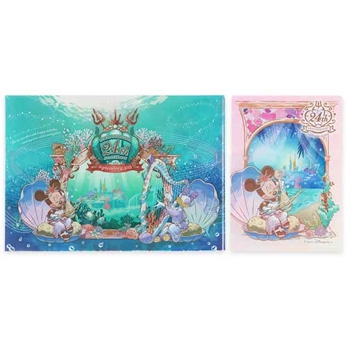 Two colorful Disney 35th anniversary folders featuring Mickey and Minnie Mouse in underwater, fantasy-themed scenes.
