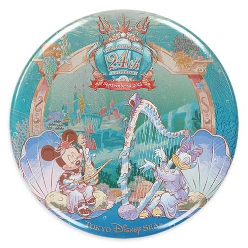 A round Tokyo DisneySea 24th anniversary button with Mickey and Donald as mermaids playing harp and flute underwater.