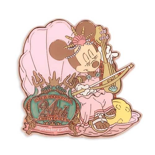 Minnie Mouse dressed as a mermaid, playing a lute, with a "Tokyo Disneyland 24th Anniversary" sign below.