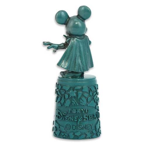 Teal figurine of Mickey Mouse in a cape, standing on a decorative Tokyo DisneySea base, facing away.