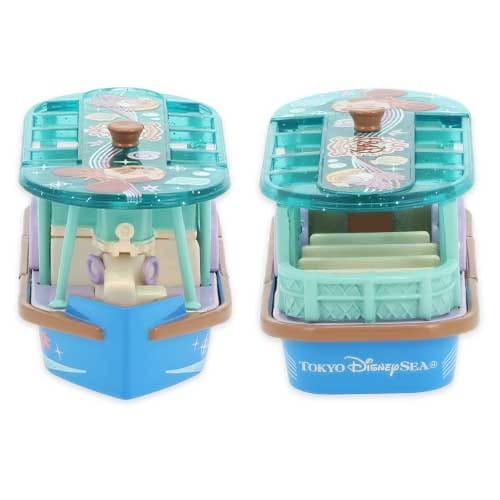 Two small blue toy boats with green roofs and "Tokyo DisneySea" printed on the front, shown from different angles.