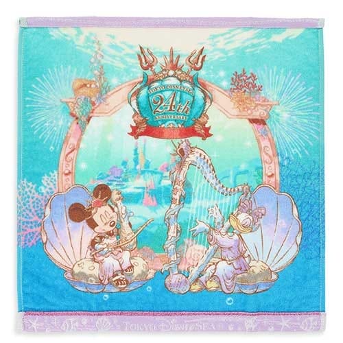 Mickey and Donald in seashells, playing instruments, with "Tokyo DisneySea 21st Anniversary" text above them.