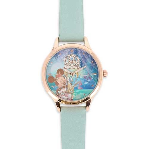 Wristwatch with a light blue strap, featuring Minnie Mouse and a castle on the watch face, with "24th Anniversary" text.