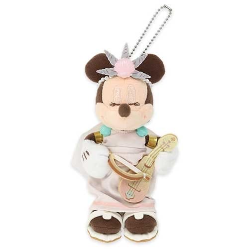 Plush Minnie Mouse in a pink dress with a headpiece, holding a lute, attached to a keychain.