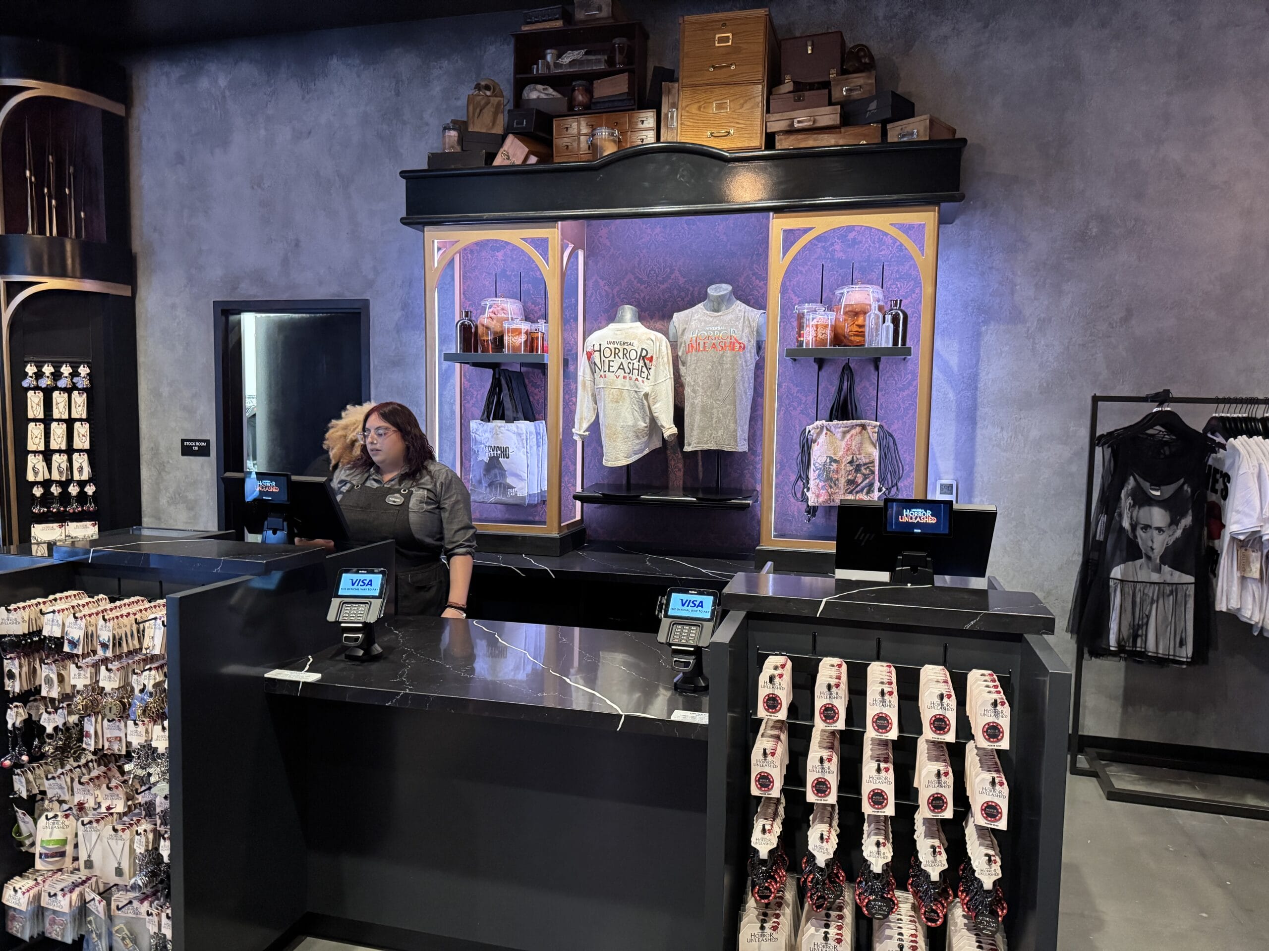 A store counter with merchandise displays and a cashier—perfect for Universal Horror Unleashed fans in Las Vegas.