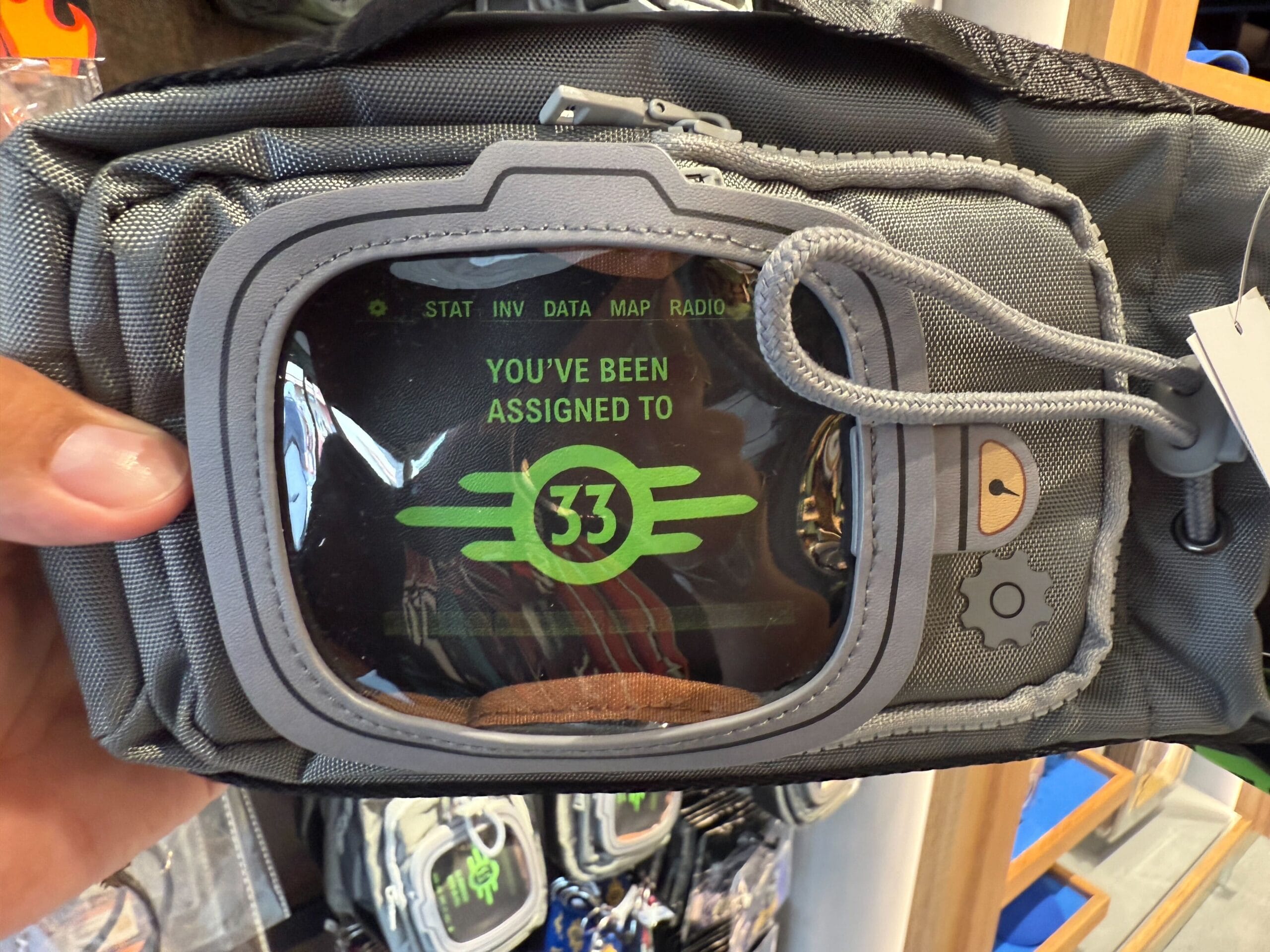 Gray bag styled like a Pip-Boy screen from Fallout—an exclusive HHN Merch find for Halloween Horror Nights 2025 Merchandise.