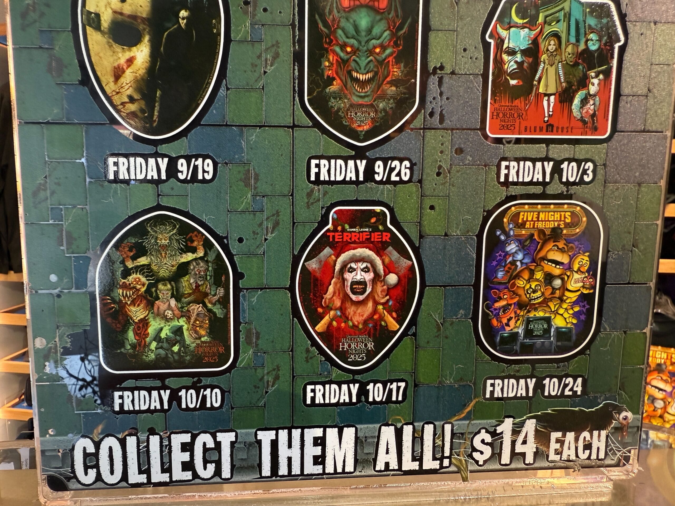 Display of collectible HHN merch horror pins with October release dates at Universal Orlando Resort for $14 each. Collect Them All!