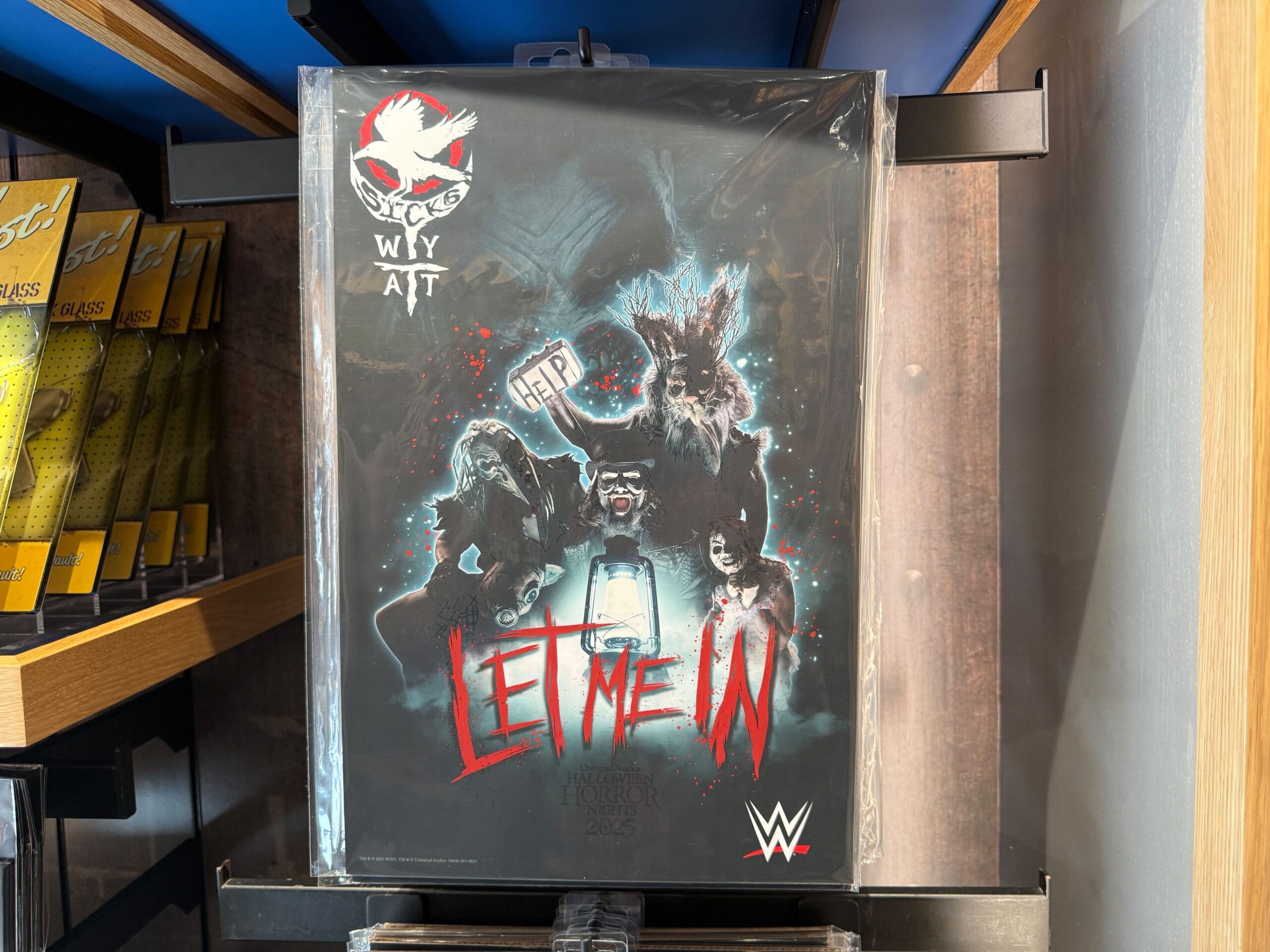 Poster featuring WWE's Wyatt Sick6 faction for Halloween Horror Nights 2025 Merchandise; "Let Me In" glows in red.