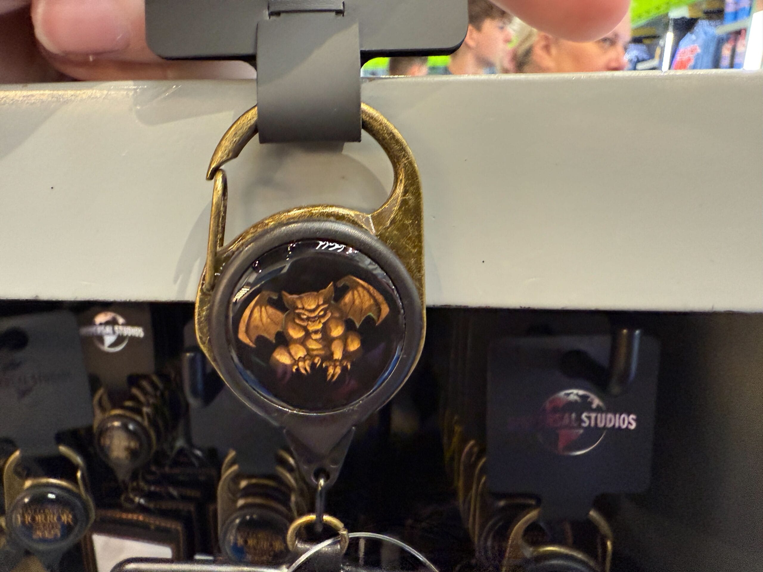 Keychain featuring a menacing winged gargoyle, part of the Halloween Horror Nights Merchandise at Universal Orlando Resort.