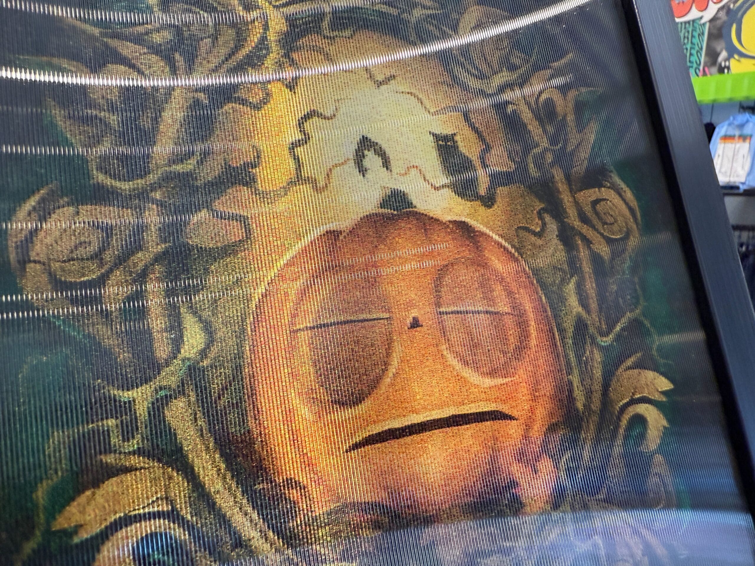 Close-up of a tired-looking pumpkin with a candle inside, surrounded by ornate vines—perfect for Lil Boo Merchandise.