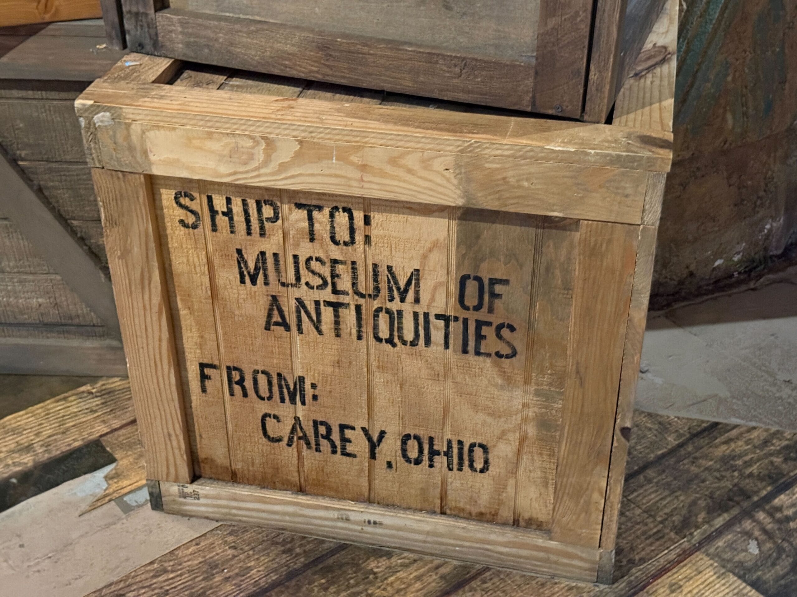 A wooden crate labeled for the Museum of Antiquities hints at the Tribute Store for Halloween Horror Nights 34.
