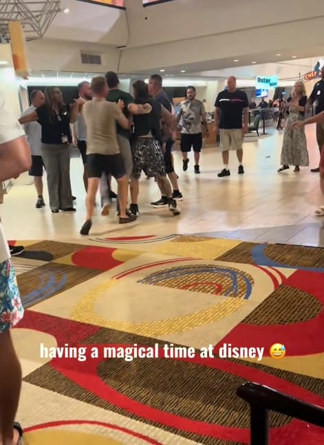 Fight at contemporary resort - A group fistfight erupts at Disney Contemporary Resort; onlookers watch as the video reads, "having a magical time at Disney.
