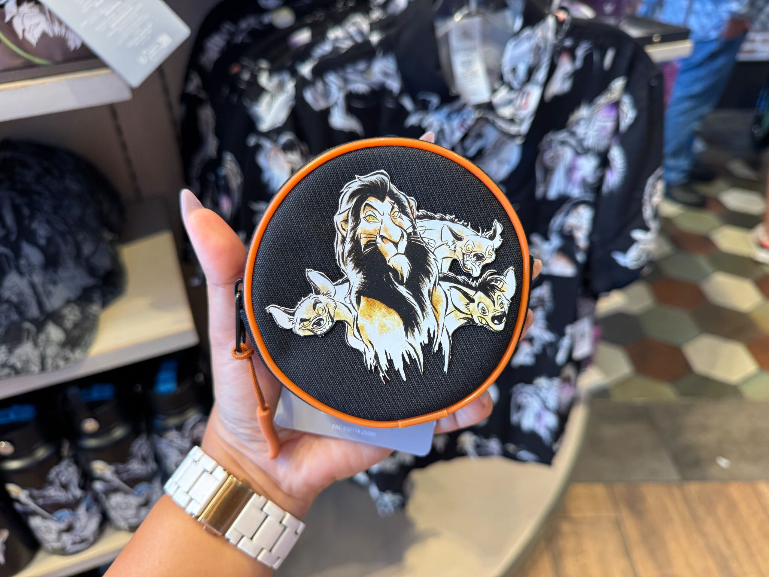 Round bag featuring Scar and hyenas from The Lion King, part of Disney Villains merchandise at Walt Disney World.