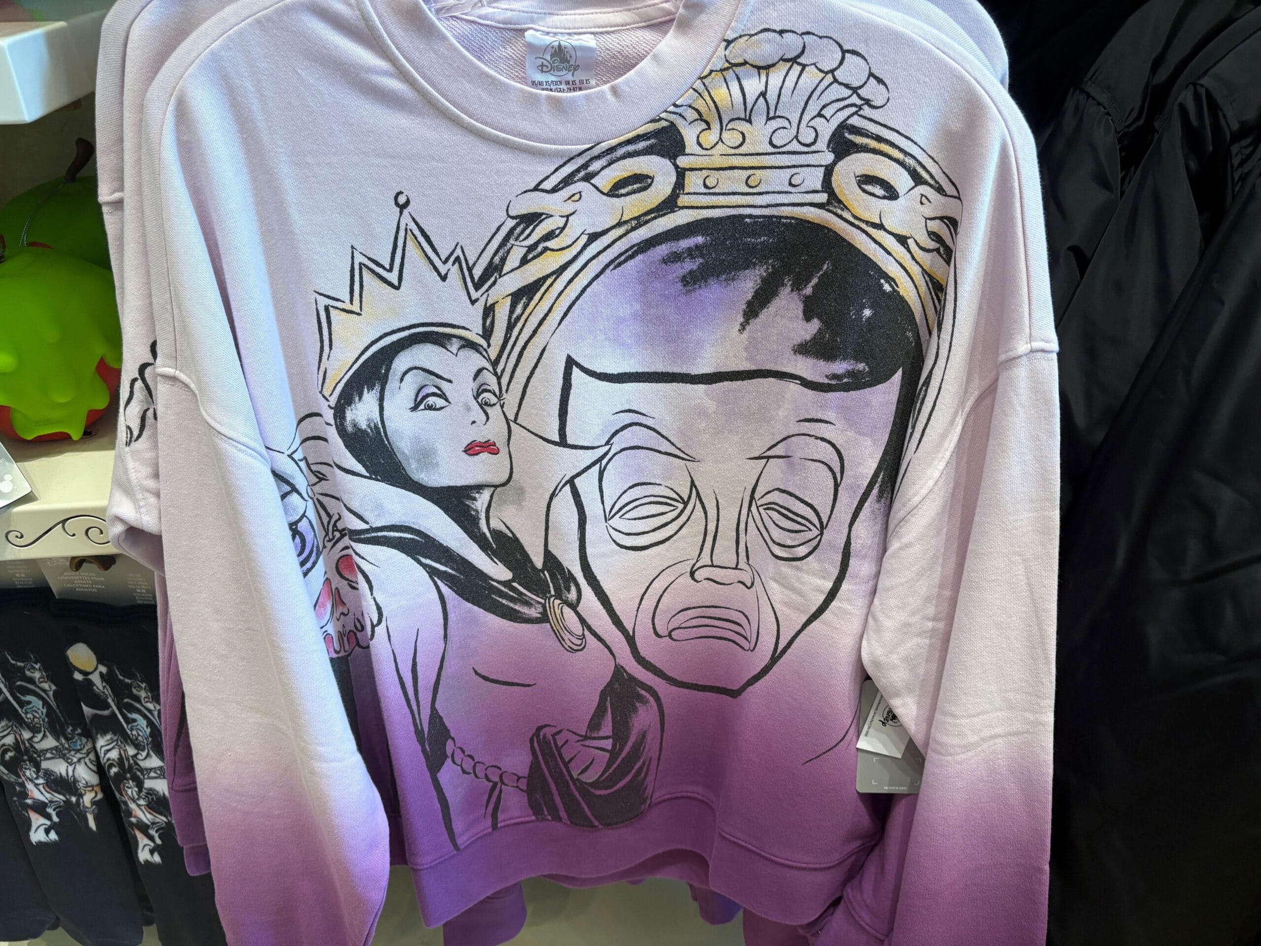 Sweatshirt with artwork of Disney's Evil Queen and her magic mirror in black, white, and purple tones.
