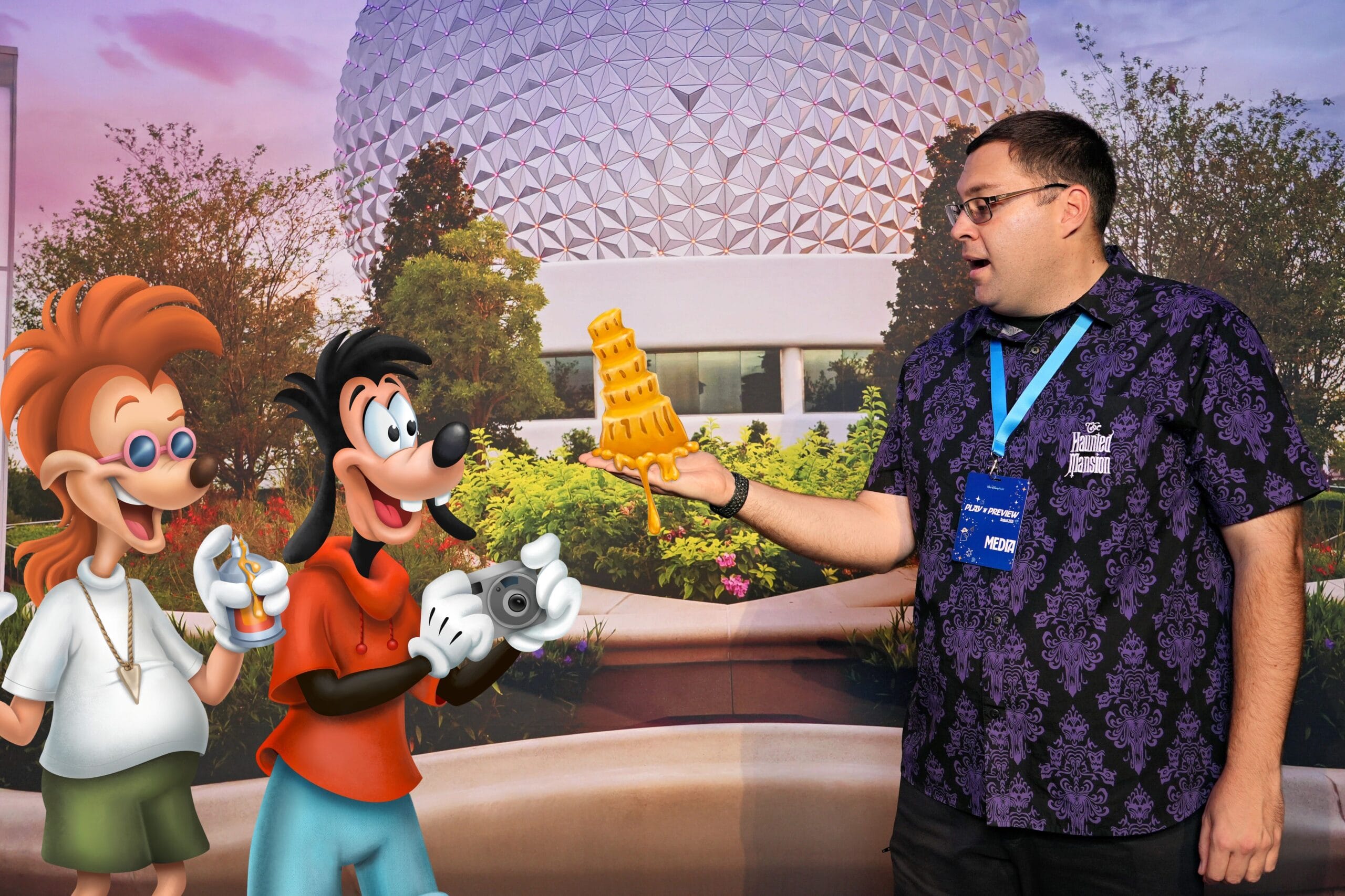 A man poses, surprised, with Max and PJ from Goofy Movie holding a cheese Pisa at the EPCOT Food & Wine Festival.